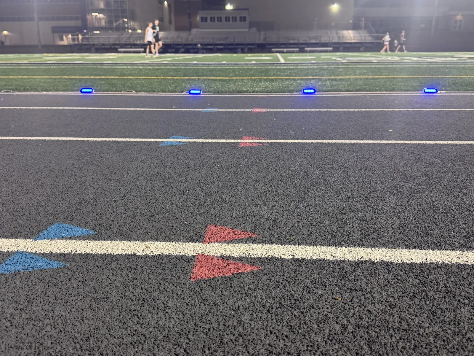 Stridelane blue pacing lights set along the track for a night race